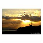 Silhouette of the Dover Coastguard Station on top of the famous white cliffs, against a tempestuous sunset.